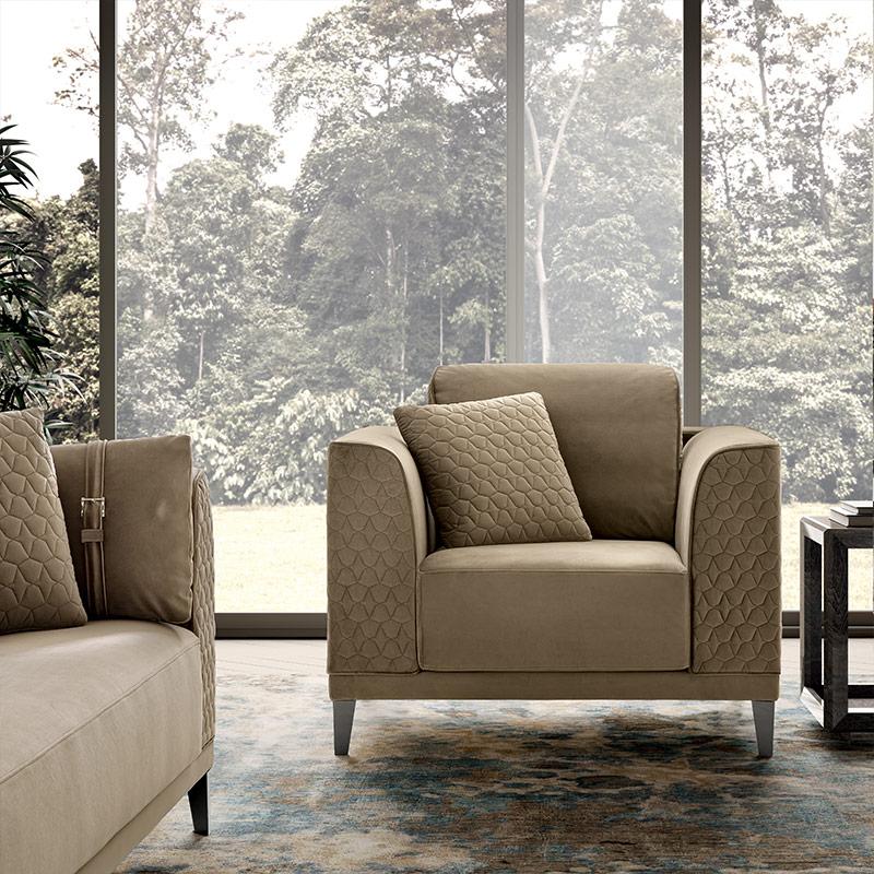 Mood Italian sofa and armchair in quilted beige velvet within a contemporary room