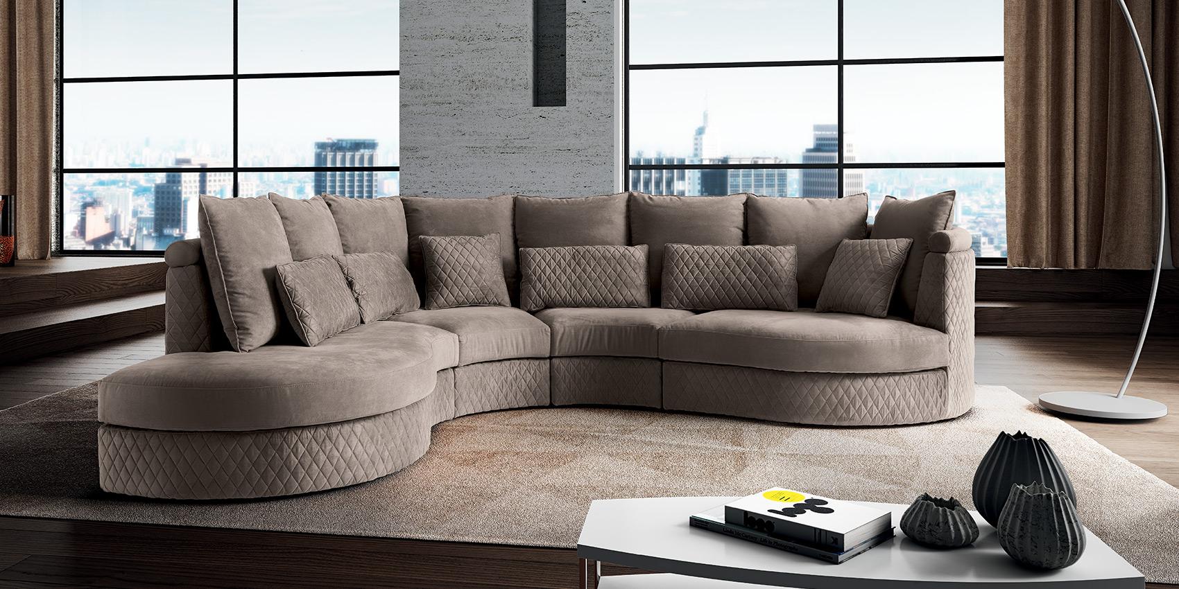 New York Italian sofa in a contemporary living room — taupe quilted fabric with a curved chaise