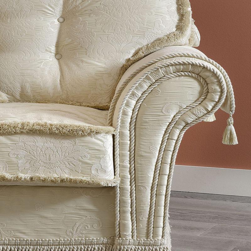 Decor classic Italian armchair in ivory damask with a rolled arm, tufted back, and fringed skirt by Camelgroup.