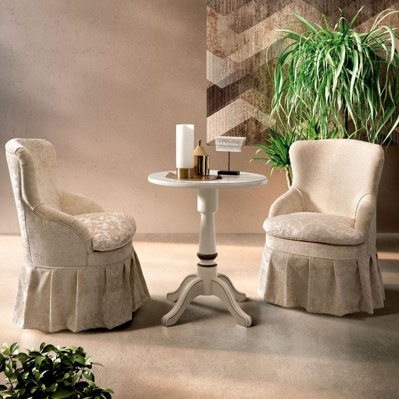 Ivory lacquer Giotto skirted bedroom chair with a matching pedestal side table.