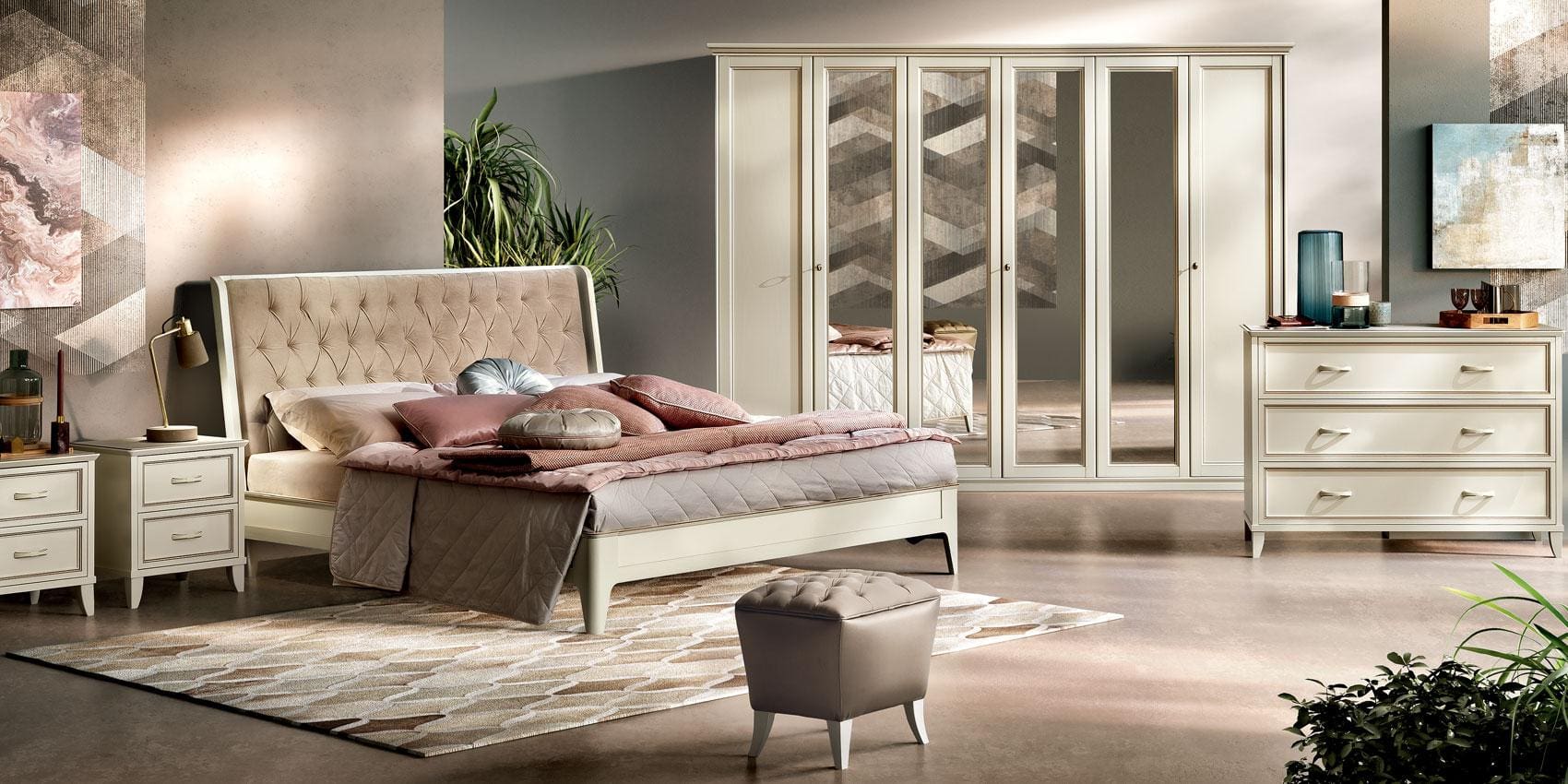 Ivory lacquer Giotto bedroom suite with an upholstered headboard, nightstands and a wardrobe.