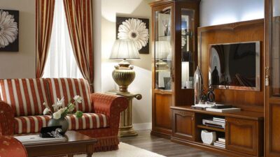 Walnut living room wall unit with arched-top glass display cabinets.