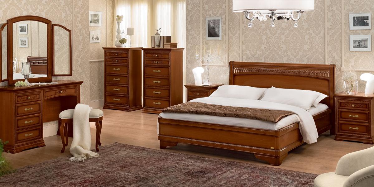 Walnut Torriani bedroom set arranged in a warm, classically styled room.