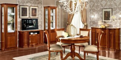 Walnut Torriani dining room suite shown in a styled room view.