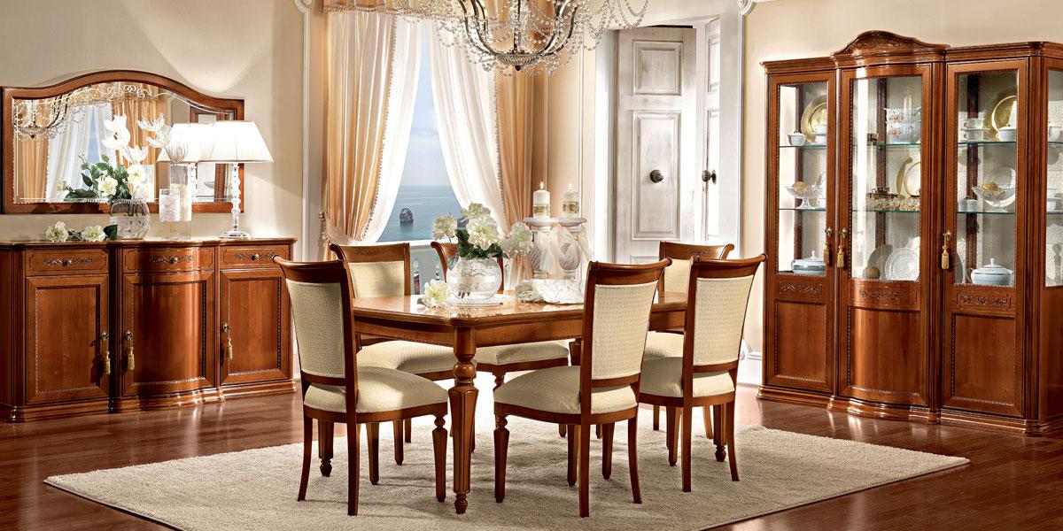 Walnut Torriani dining suite arranged as a complete room set on a wide shot.